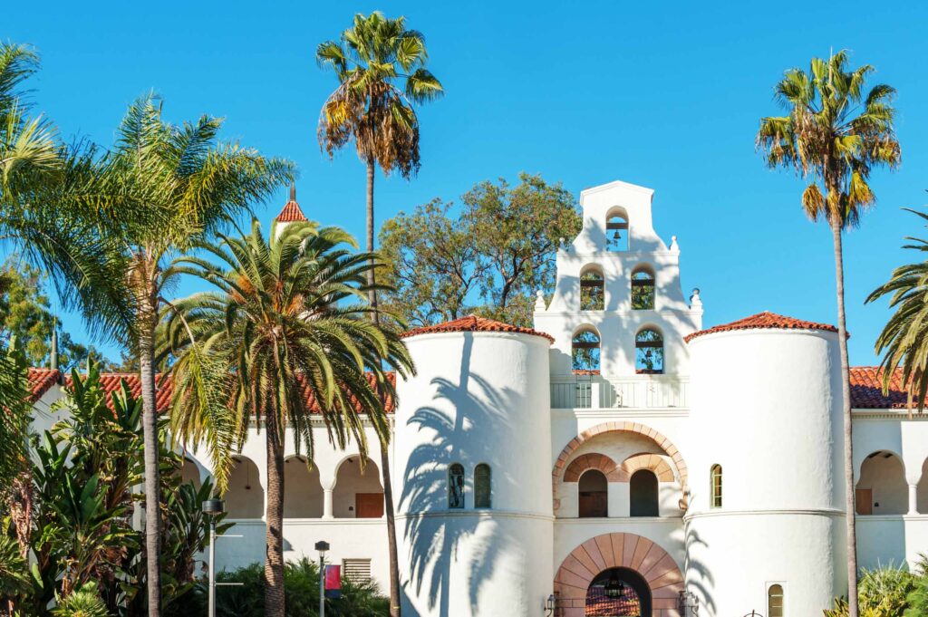 Spanish style building surrounded by palm trees