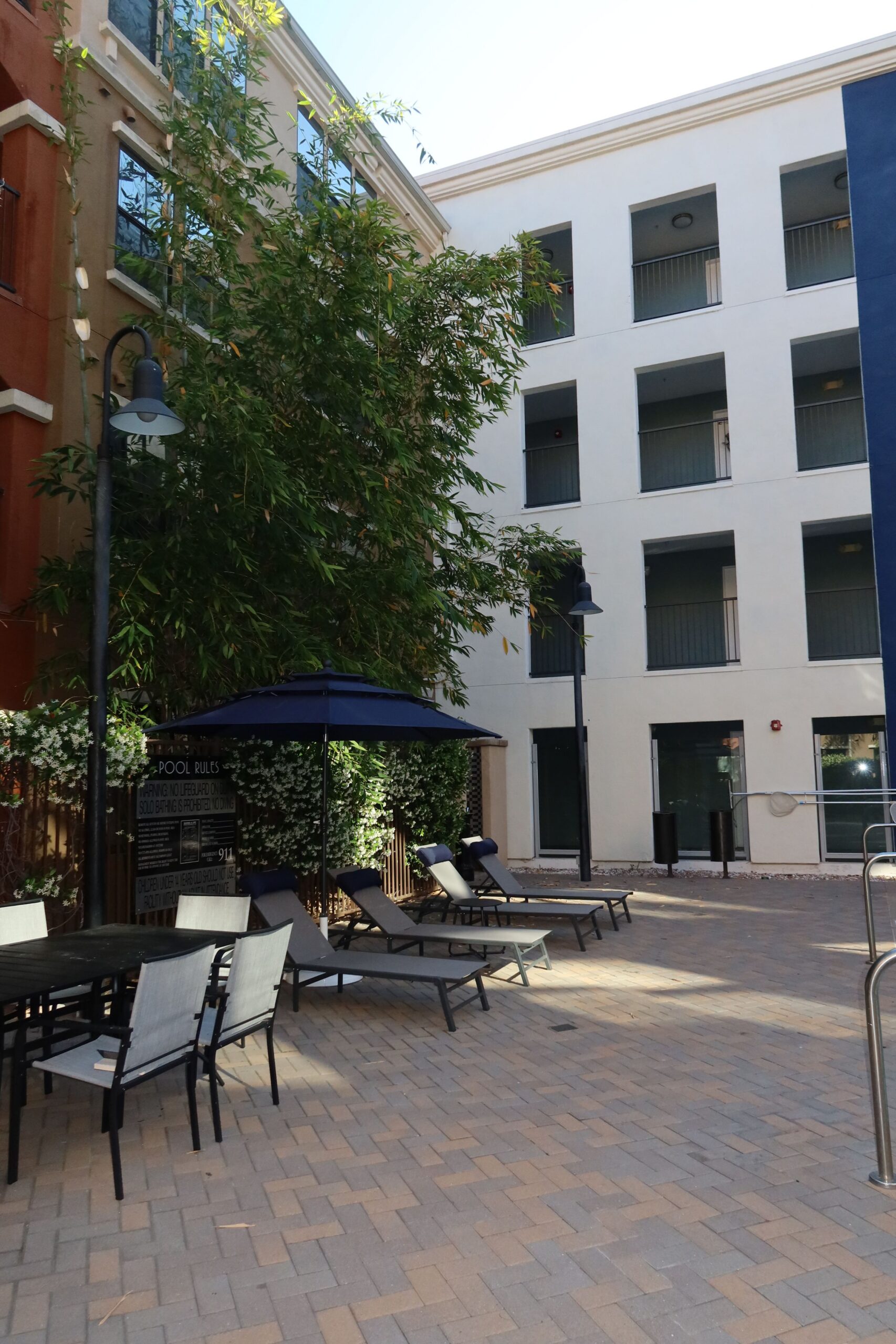 apartment courtyard poolside lounge chairs scaled