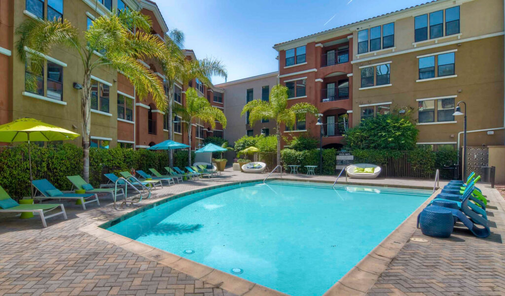Resort style pool in front of apartment buildings edited